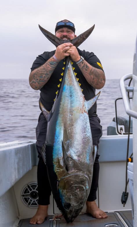 Derek Marso holding a large tuna