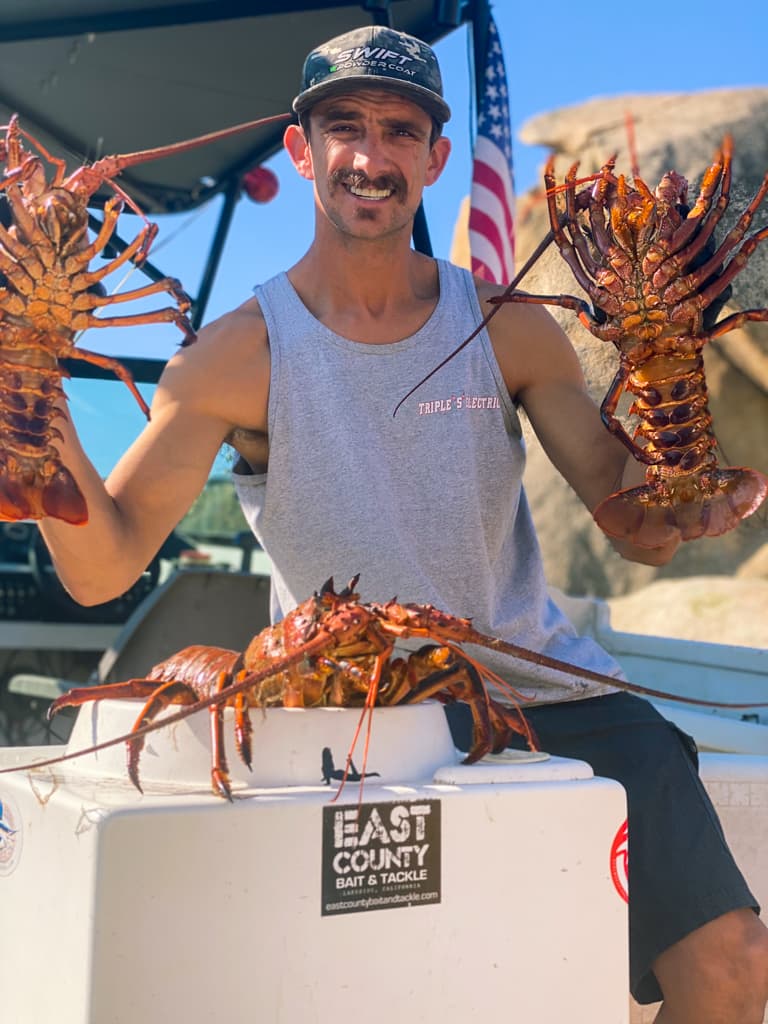 Josh Senn holding lobsters